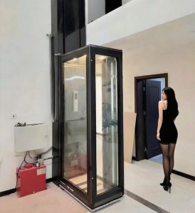 a black home elevator with a lady stand nearby