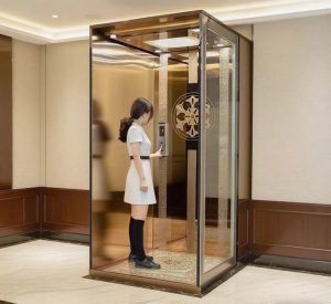 a small house elevator in golden frame.