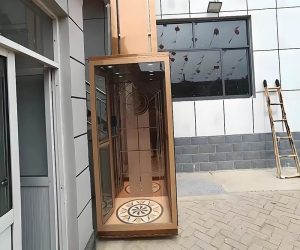 a golden frame elevator installed outside of a building