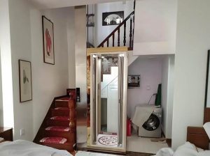 a pit less home elevator installed near the staircase.