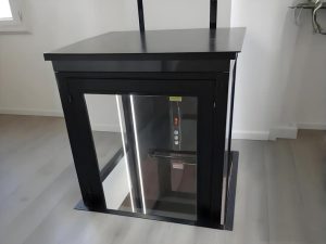 a small home elevator installed inside a modern house in US